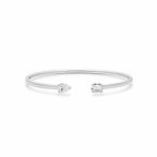 My Store 4 open cuff bracelet in white gold with a pear-cut and an emerald-cut diamond on a minimalist band.