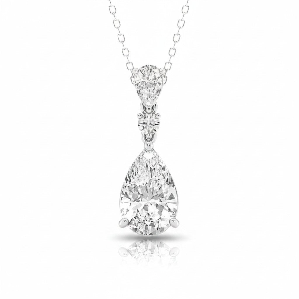 My Store 4 three-stone diamond drop pendant necklace in 18K white gold featuring pear and round cut stones.
