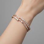 My Store 4 rose gold open bangle bracelet featuring alternating rows of baguette and round brilliant cut diamonds.