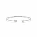 My Store 4 open cuff bracelet in white gold with a pear-cut and emerald-cut diamond in a minimalist prong setting.