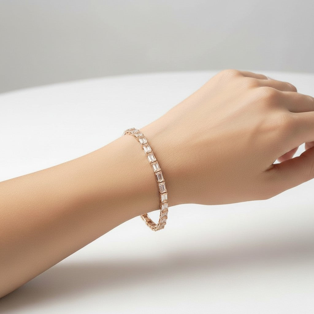 My Store 4 modern east-west emerald cut diamond bracelet in rose gold worn on a woman's wrist