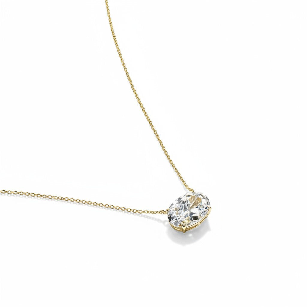 My Store 4 oval-cut diamond solitaire pendant set horizontally in 18K yellow gold on a delicate cable chain.