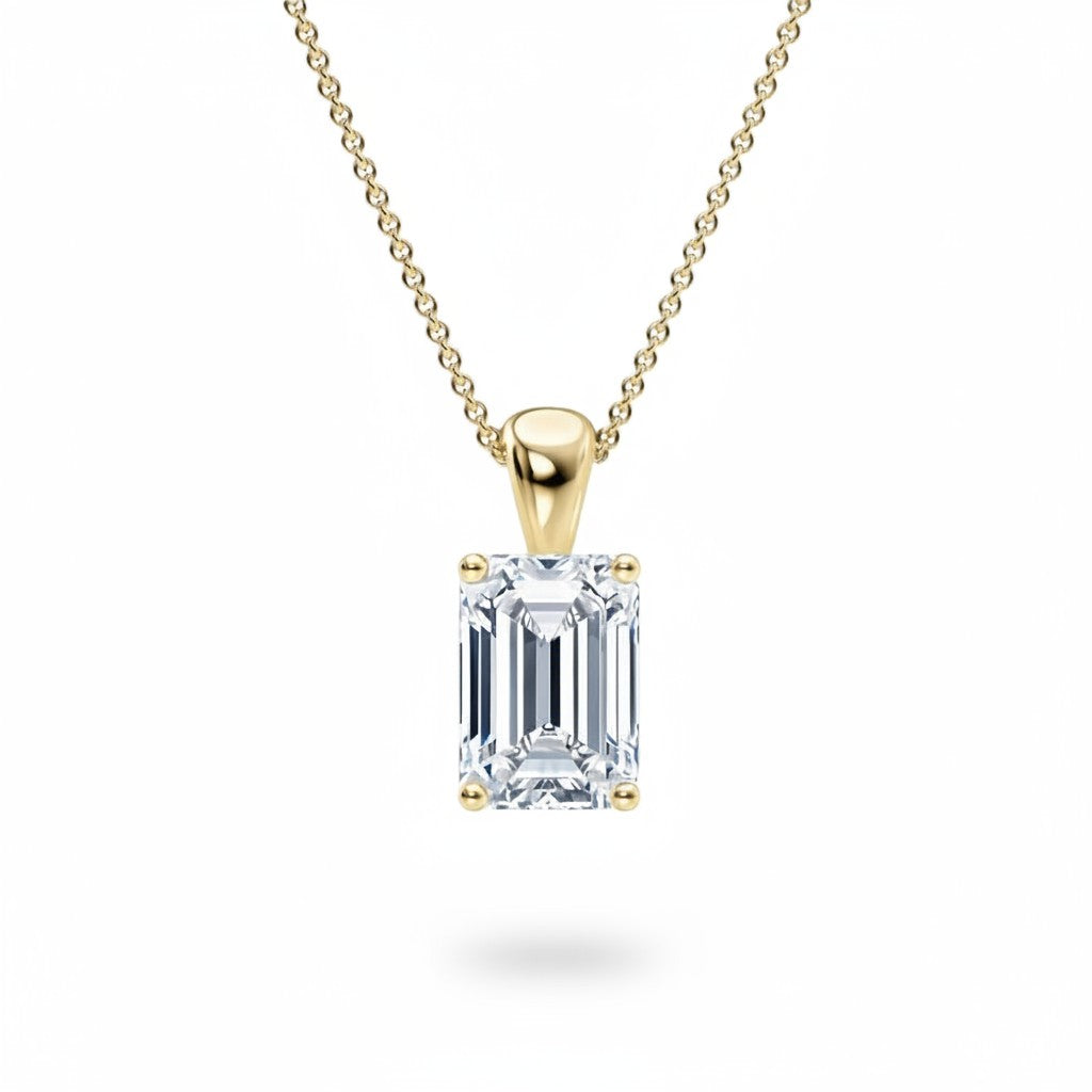 My Store 4 emerald-cut diamond solitaire pendant in 18K yellow gold on a matching fine cable chain.