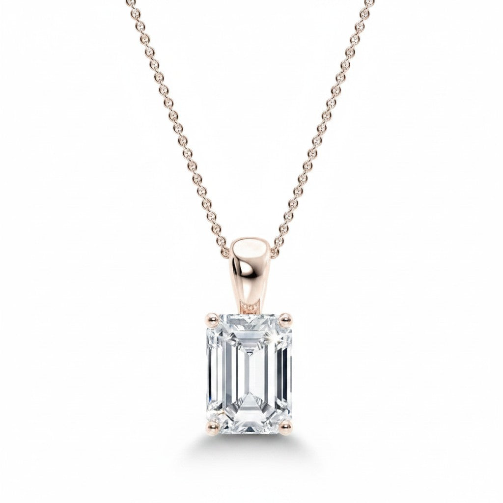 My Store 4 emerald-cut diamond solitaire pendant in 18K gold with a tapered bail on a delicate cable chain