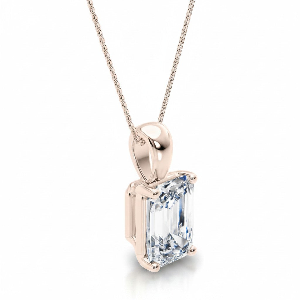 My Store 4 emerald-cut diamond solitaire pendant in 18K gold with a tapered bail on a fine cable chain