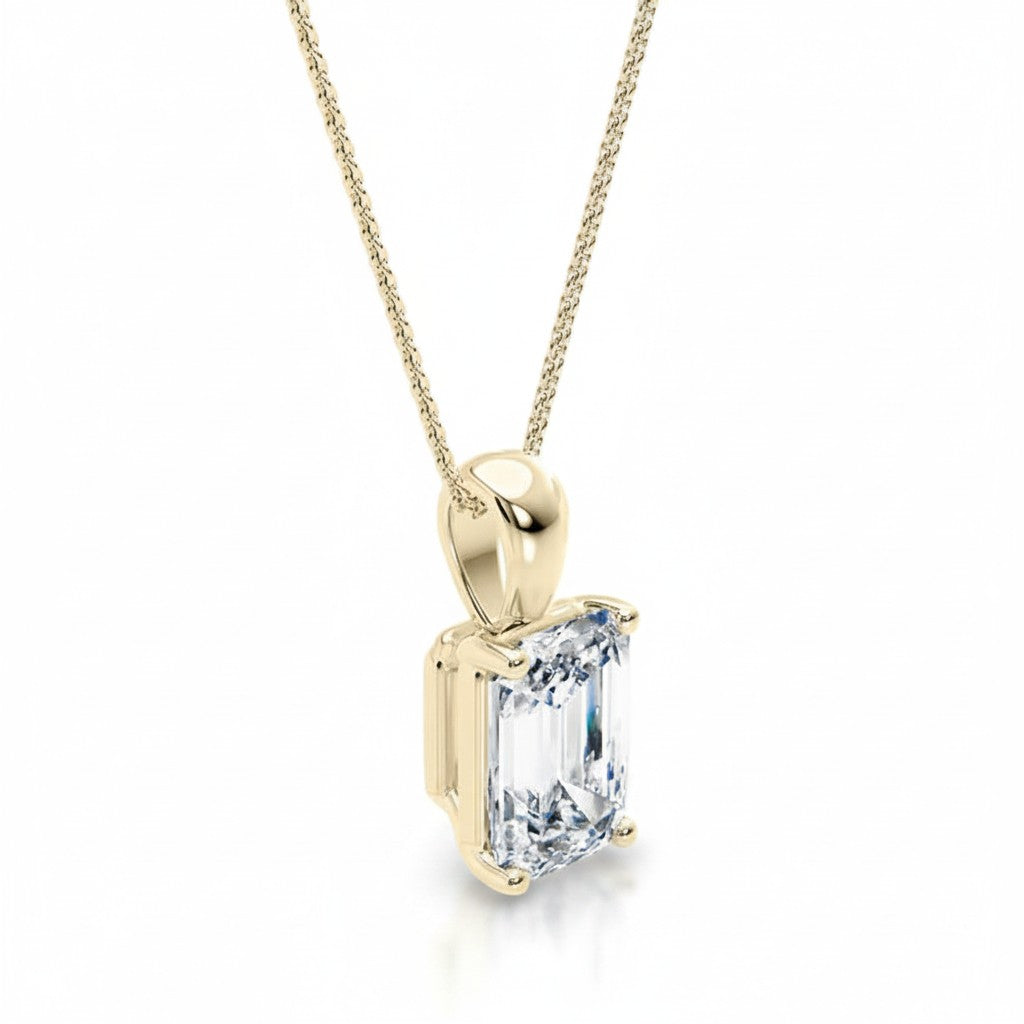 My Store 4 emerald-cut diamond solitaire pendant necklace in 18K yellow gold with a tapered bail and fine cable chain.