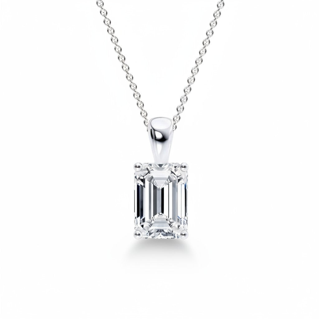 My Store 4 emerald-cut diamond solitaire pendant on a delicate silver chain with a polished tapered bail.