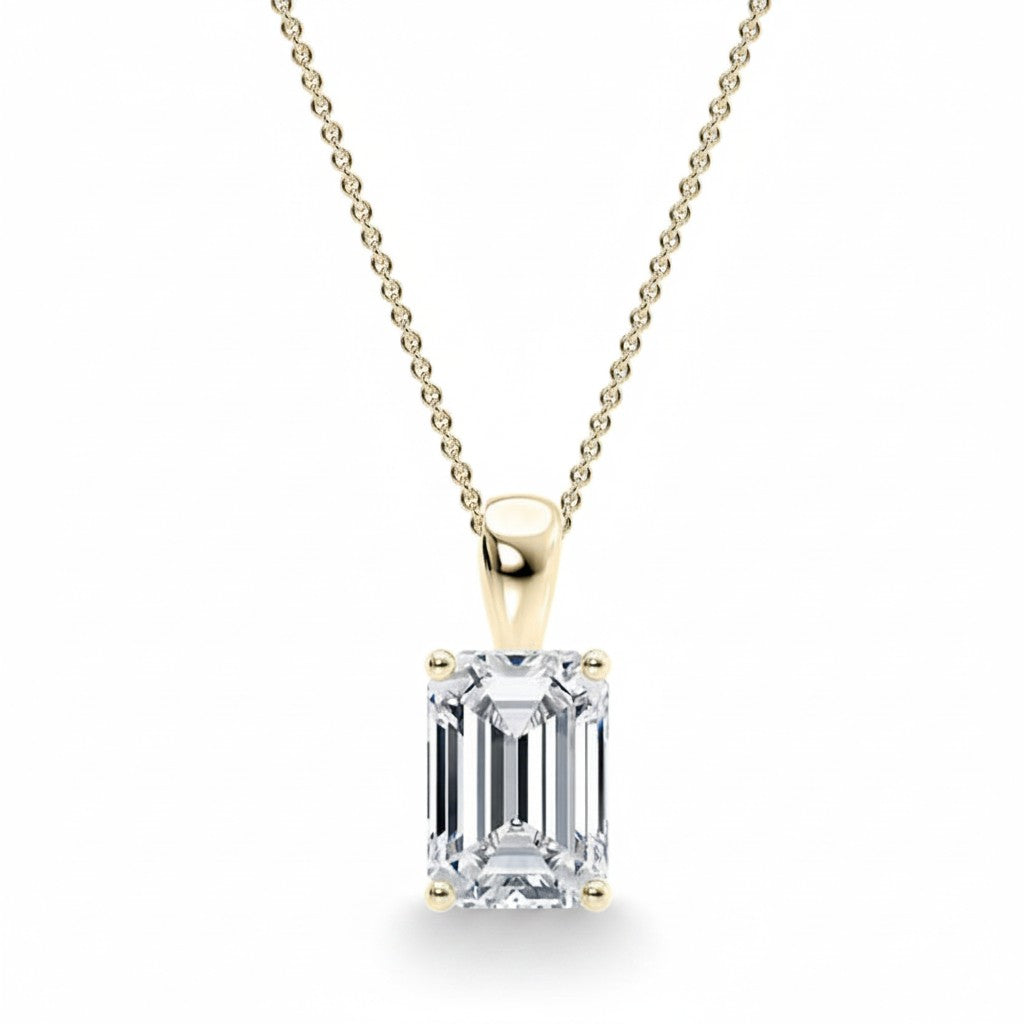 My Store 4 emerald-cut diamond solitaire pendant in 18K yellow gold with a tapered bail on a fine cable chain.