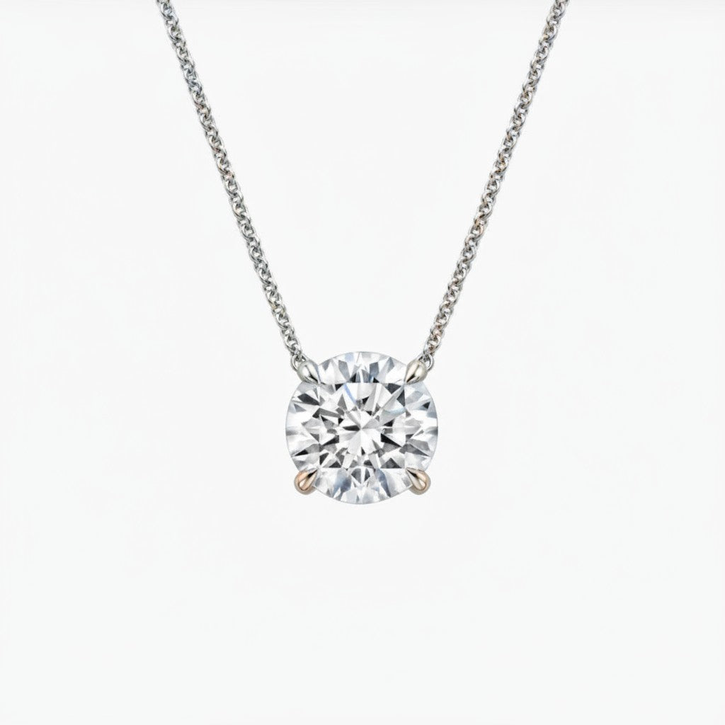 My Store 4 round brilliant-cut diamond solitaire pendant in a minimalist four-prong floating setting on a fine chain.