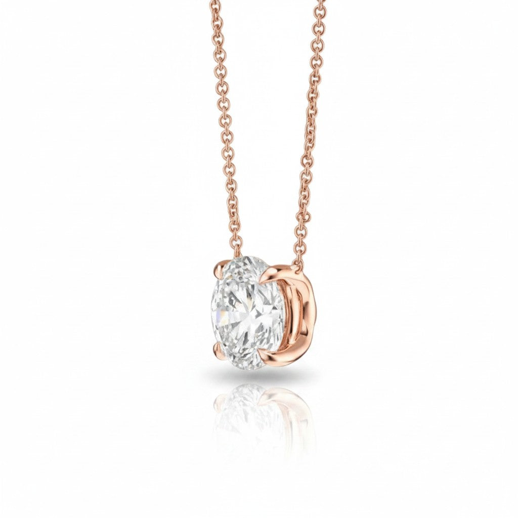My Store 4 floating round diamond solitaire pendant in 18K rose gold with a minimalist four-prong bail-free setting.