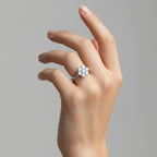 My Store 4 seven-stone floral cluster engagement ring with brilliant-cut diamonds on a polished white gold band.