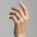 My Store 4 floral cluster engagement ring with seven brilliant-cut stones on a polished solid gold tapered band.