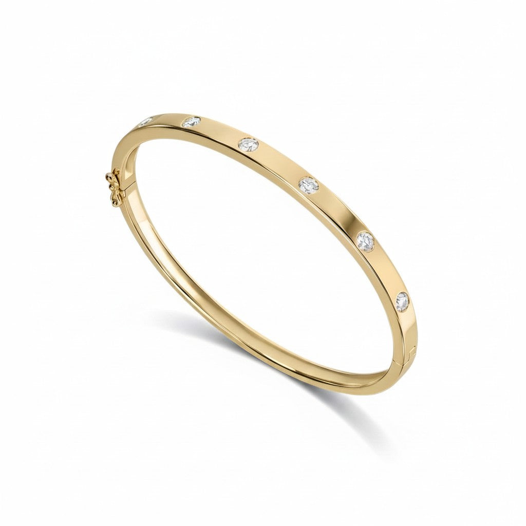 My Store 4 yellow gold bangle bracelet featuring round flush-set diamonds in a sleek, snag-free design with hinge clasp.