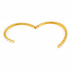 My Store 4 gold open bangle bracelet featuring a bypass design with alternating pear and heart cut diamonds.