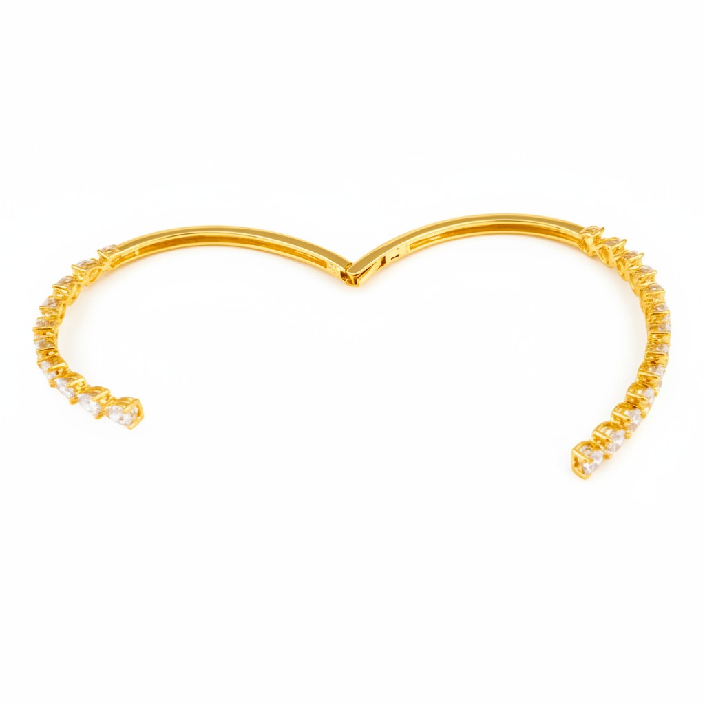 My Store 4 gold open bangle bracelet featuring a bypass design with alternating pear and heart cut diamonds.