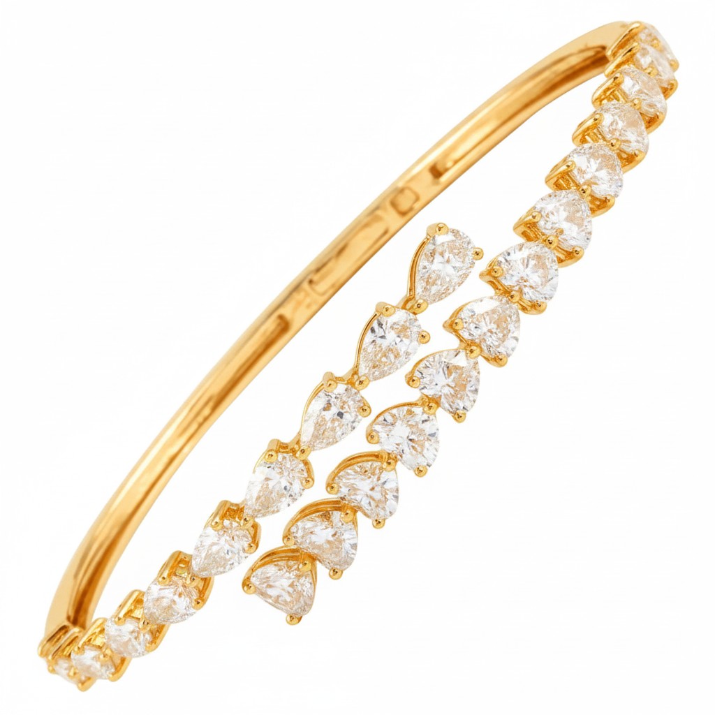 My Store 4 gold open bangle bracelet featuring alternating pear and heart cut diamonds in a bypass design.
