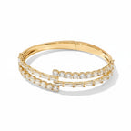 My Store 4 gold bypass open bangle bracelet featuring alternating baguette and round brilliant cut diamonds.