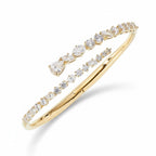 My Store 4 contemporary gold bypass bangle featuring round, marquise, and pear-cut diamonds in a dual-layer cuff design.