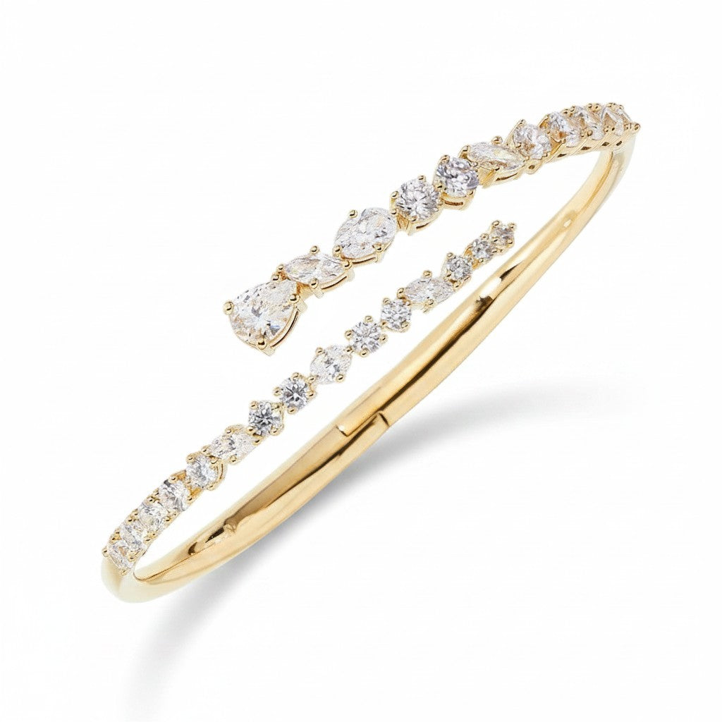 My Store 4 contemporary gold bypass bangle featuring round, marquise, and pear-cut diamonds in a dual-layer cuff design.