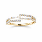 My Store 4 gold bypass open bangle bracelet featuring alternating rows of baguette and round brilliant diamonds.