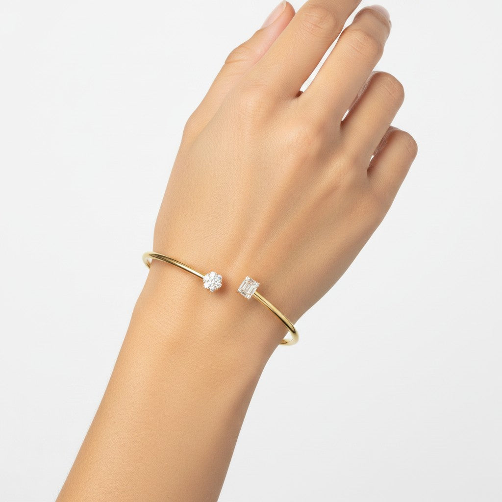 My Store 4 gold open cuff bracelet featuring a round diamond cluster and a rectangular baguette diamond on a wrist