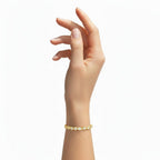 My Store 4 custom yellow gold tennis bracelet with round brilliant diamonds worn on a woman's wrist