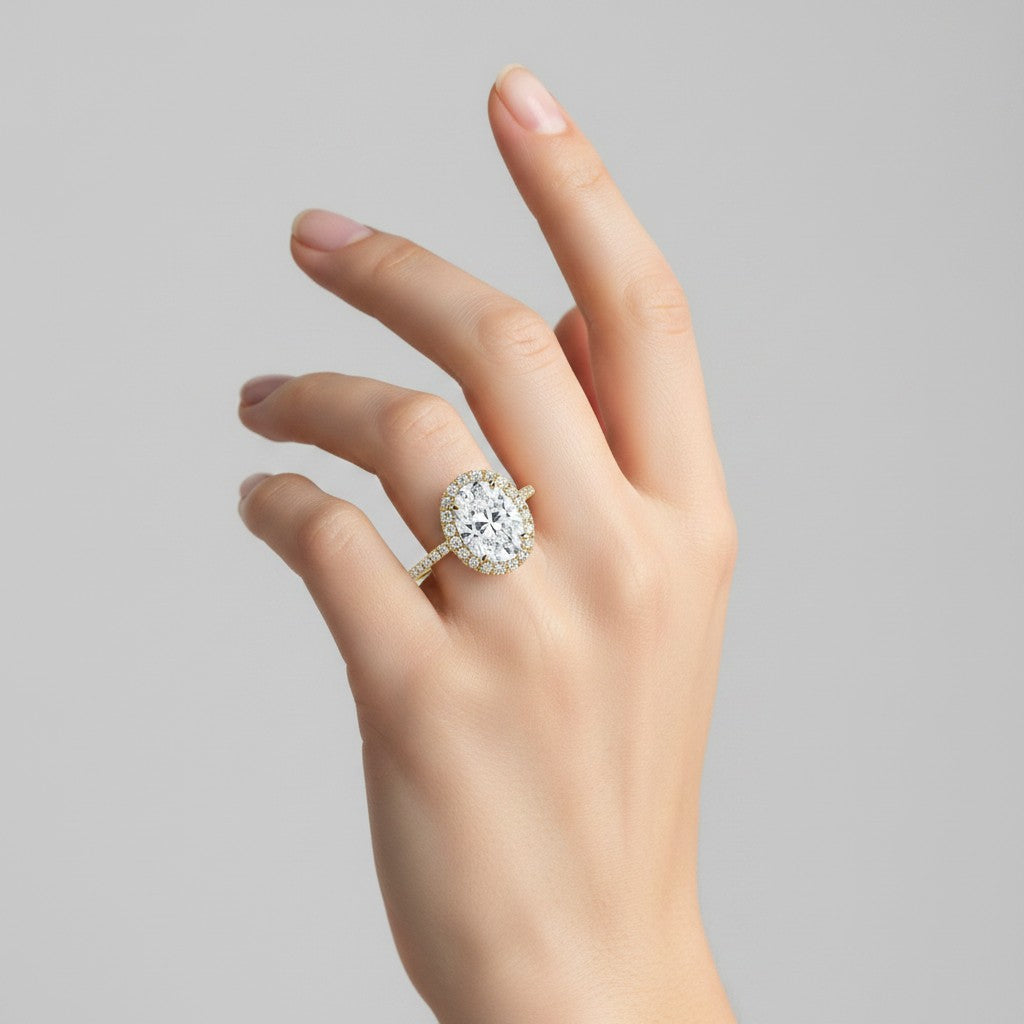 My Store 4 18K solid gold halo pavé lab diamond ring set worn on a woman's hand against a neutral background.