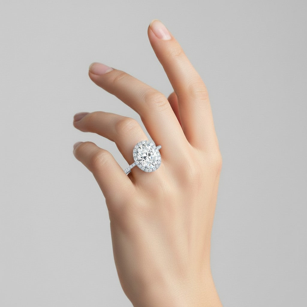 My Store 4 18K solid gold halo engagement ring with pavé lab-grown diamonds worn on a woman's finger