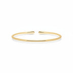 My Store 4 minimalist open cuff bracelet in polished yellow gold with a sleek, tapered design.