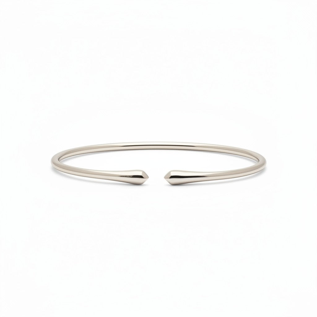 My Store 4 minimalist open cuff bracelet in polished gold with a sleek, tapered design on a white background.