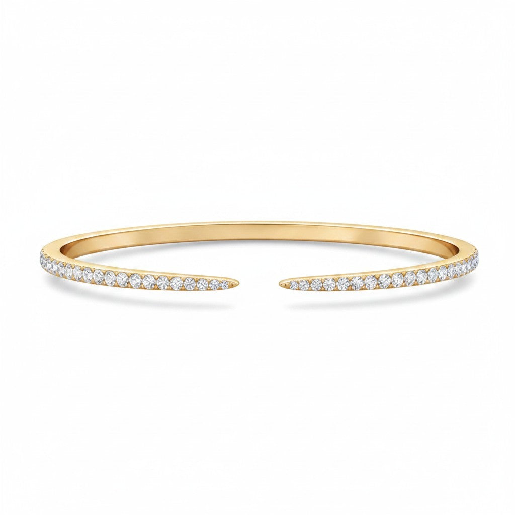 My Store 4 open cuff bangle bracelet in yellow gold with a micro-pavé diamond setting on a white background.