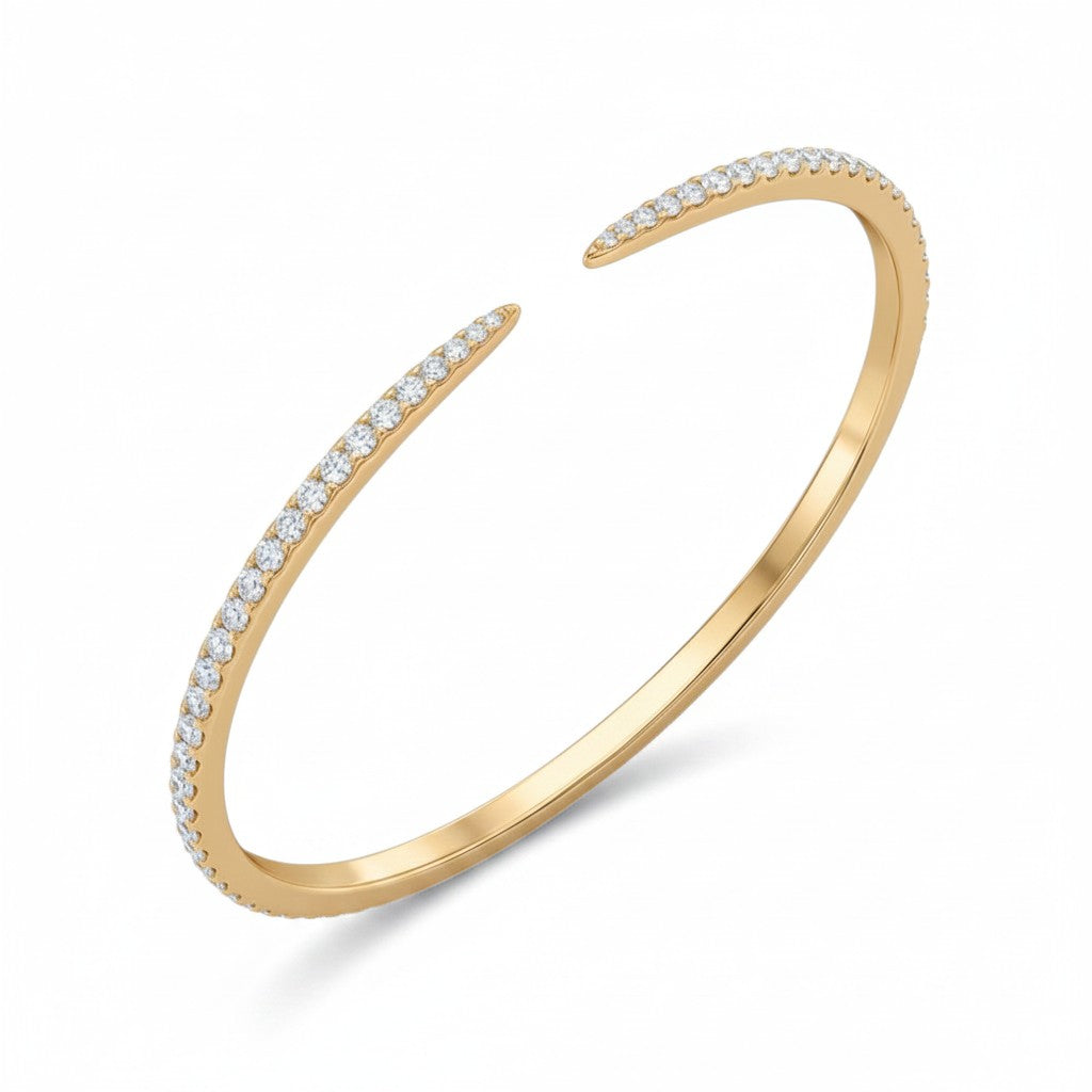 My Store 4 open pavé diamond bangle bracelet in 14K yellow gold with a sleek, flexible cuff design.