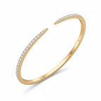 My Store 4 open pavé diamond bangle bracelet in 14K yellow gold with a sleek, flexible cuff design.