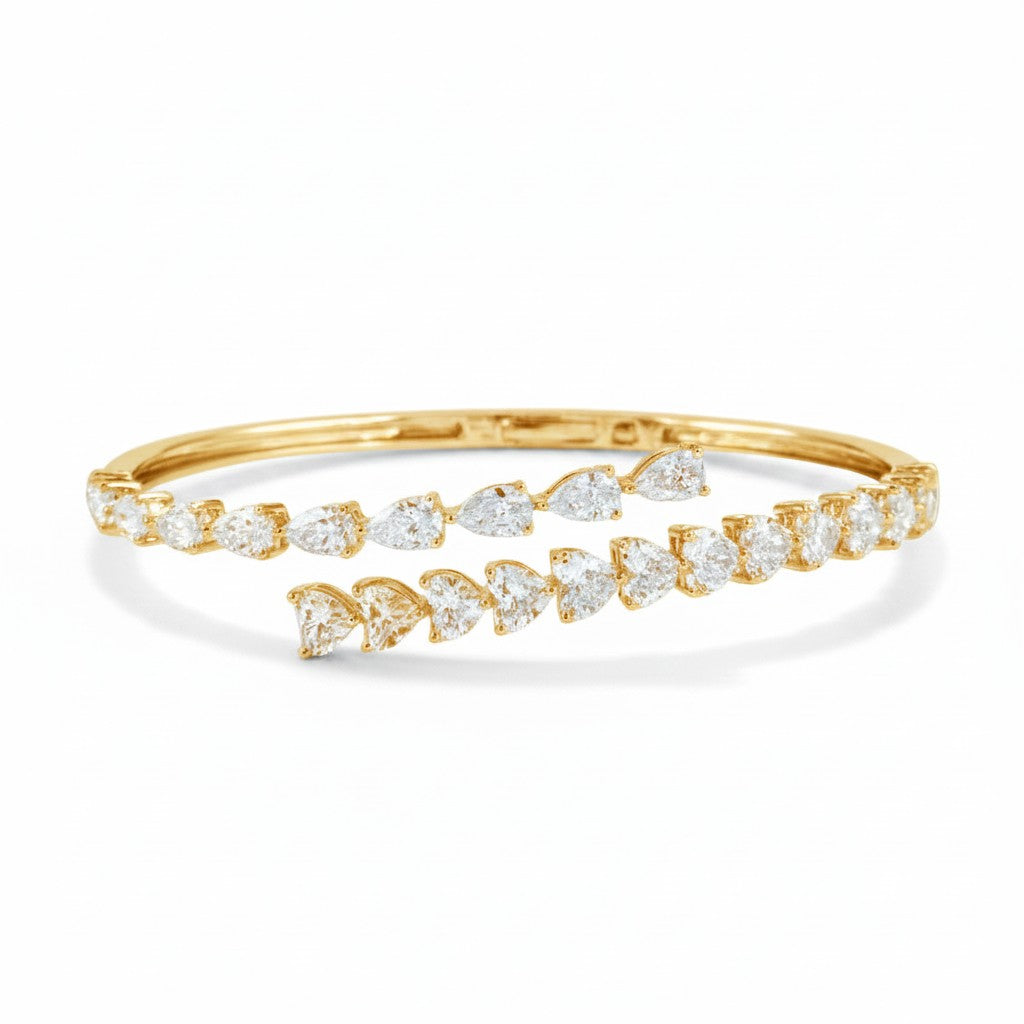 My Store 4 yellow gold bypass open bangle bracelet featuring alternating pear-cut and heart-cut diamond stones.