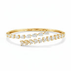 My Store 4 yellow gold bypass open bangle bracelet featuring alternating pear-cut and heart-cut diamond stones.