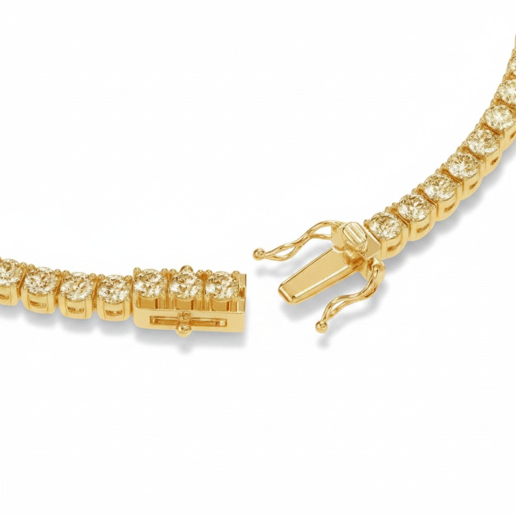 My Store 4 gold tennis bracelet featuring a secure box clasp with dual safety latches and round brilliant diamonds.