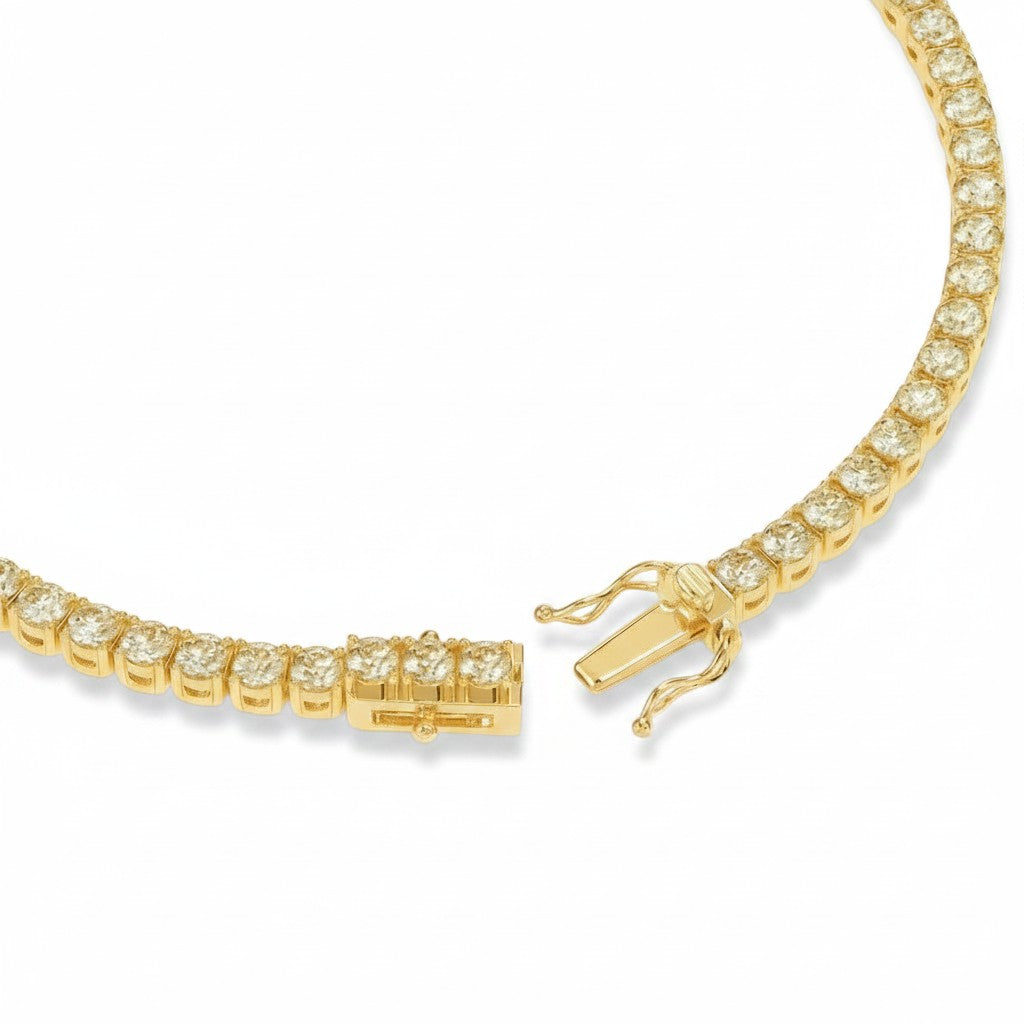 My Store 4 gold tennis bracelet with round diamonds and a secure box clasp with dual safety latches.