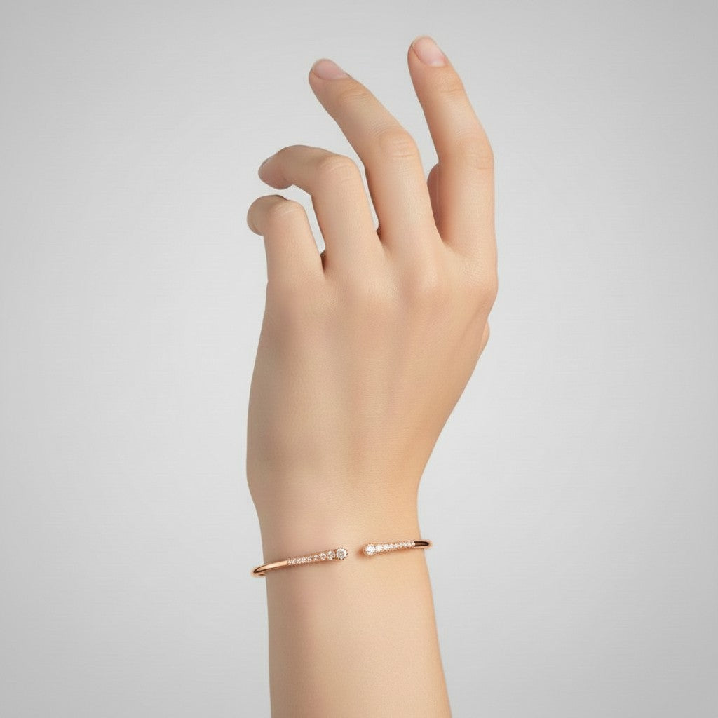 My Store 4 graduated diamond open cuff bracelet in rose gold worn on a woman's wrist