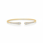 My Store 4 graduated diamond open cuff bracelet in polished yellow gold with round brilliant cut stones.