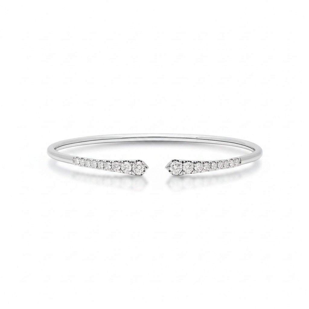 My Store 4 graduated diamond open cuff bracelet in polished white gold with round brilliant cut stones in shared prongs.
