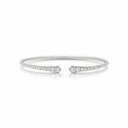 My Store 4 graduated diamond open cuff bracelet in polished white gold with round brilliant cut stones in shared prongs.