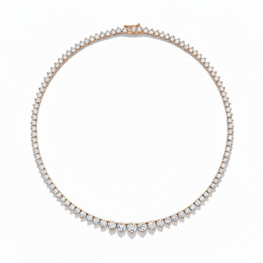 My Store 4 graduated Riviera diamond tennis necklace in 18K gold with a three-prong setting on a white background.