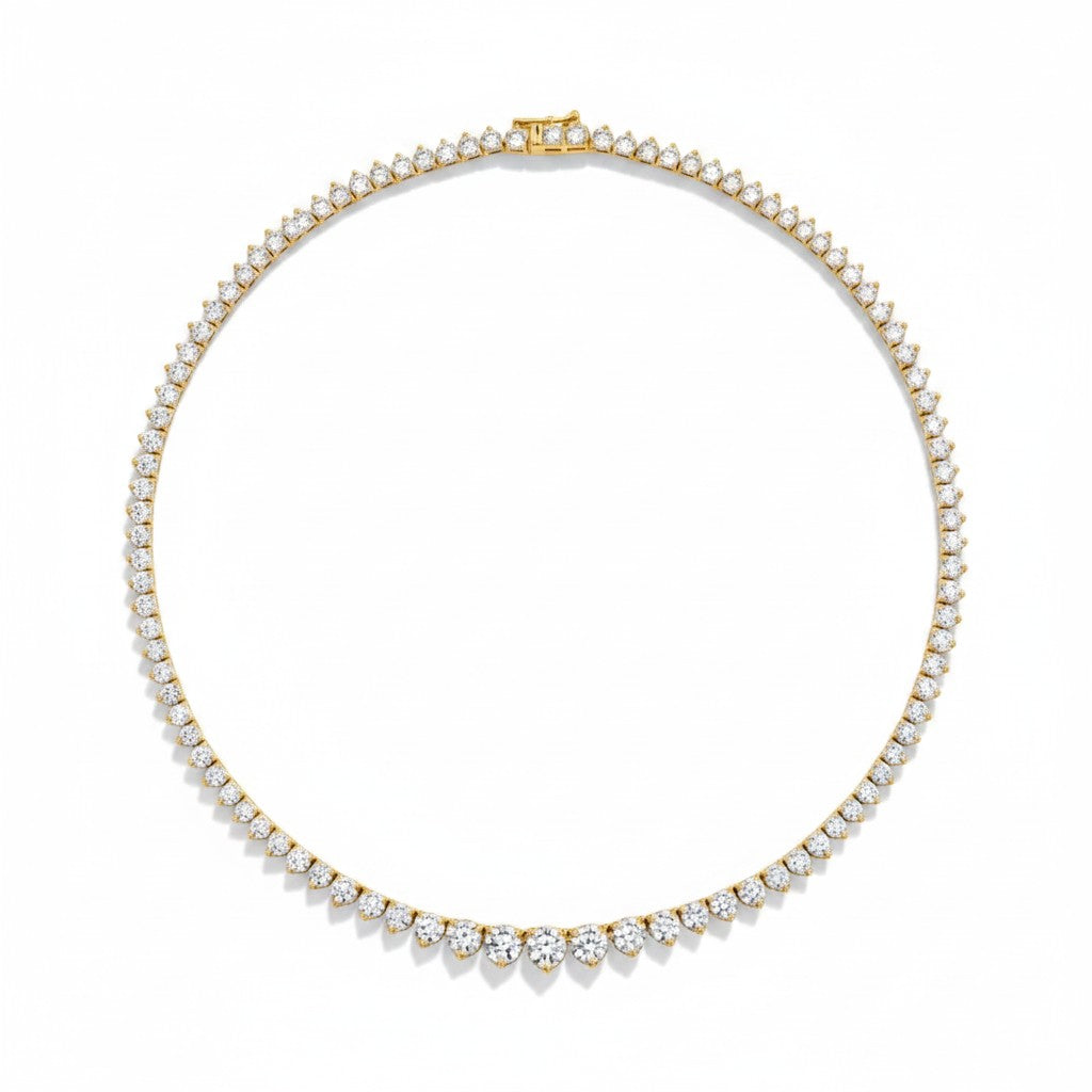 My Store 4 graduated Riviera diamond tennis necklace in yellow gold with a three-prong setting on a white background.