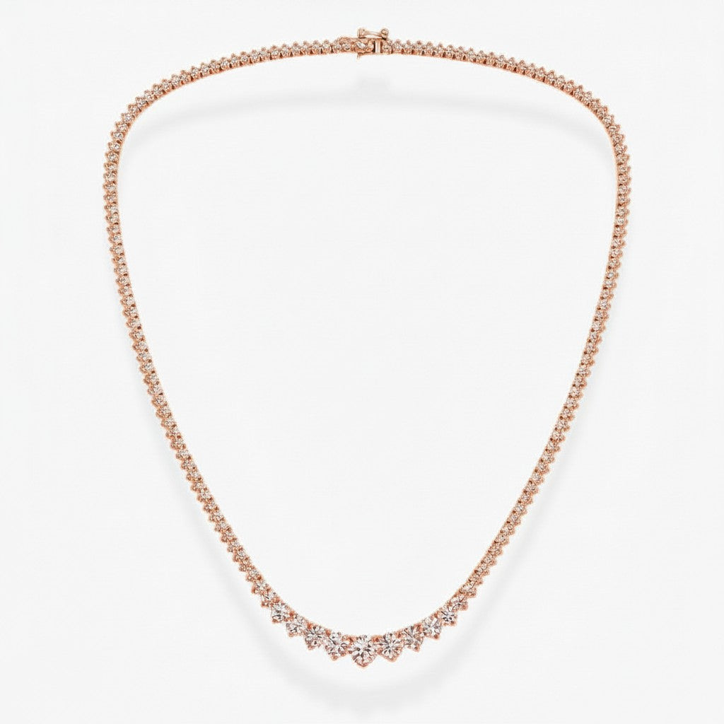 My Store 4 graduated rose gold tennis necklace featuring a three-prong diamond setting in a classic Riviera style.