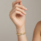 My Store 4 18K solid gold bracelet featuring heart-shaped lab-grown diamonds in polished bezel settings on a wrist.