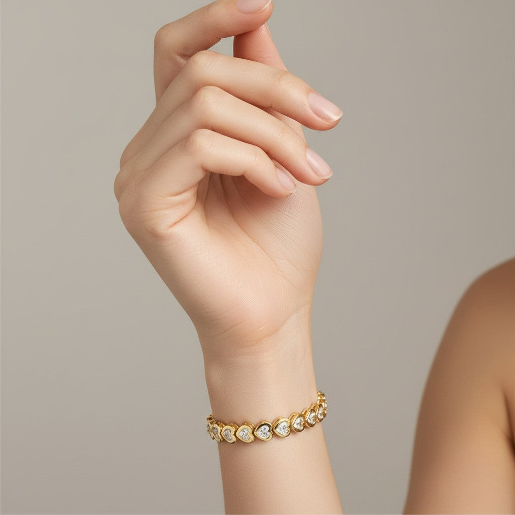 My Store 4 18K solid gold bracelet featuring heart-shaped lab-grown diamonds in polished bezel settings on a wrist.