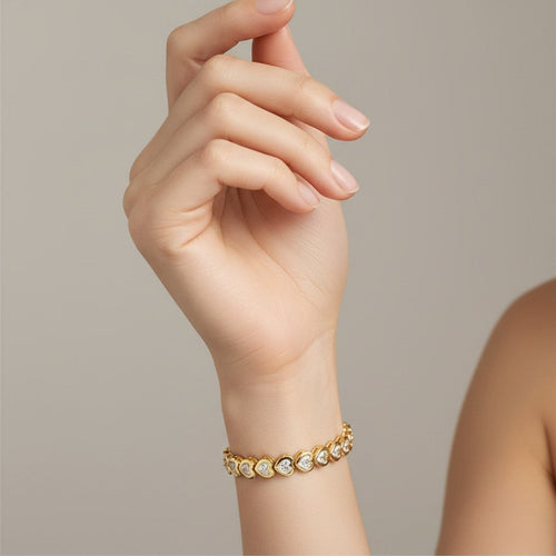 My Store 4 18K solid gold bracelet featuring heart-shaped lab-grown diamonds in polished bezel settings on a wrist.