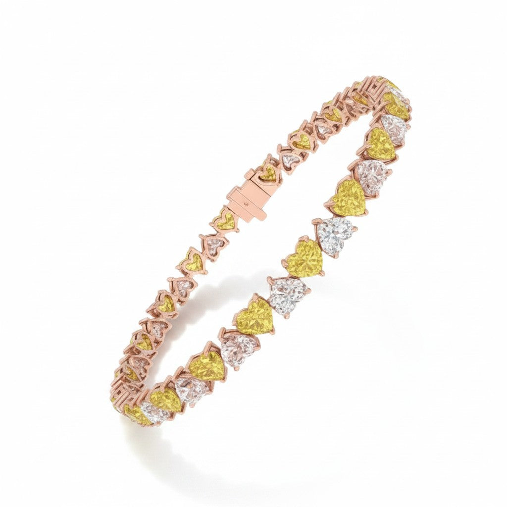 My Store 4 tennis bracelet featuring alternating fancy yellow and white heart-cut diamonds in a two-tone gold setting.