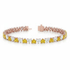 My Store 4 two-tone gold tennis bracelet featuring alternating fancy yellow and white heart-cut diamonds.