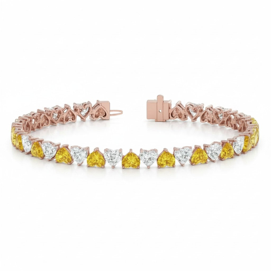 My Store 4 two-tone gold tennis bracelet featuring alternating fancy yellow and white heart-cut diamonds.